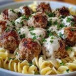 Garlic Butter Meatballs Over Creamy Parmesan Pasta
